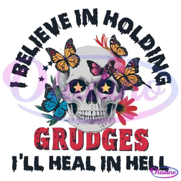 A graphic of a skull adorned with colorful butterflies and red flowers. Bold text above the skull reads "I BELIEVE IN HOLDING," while text below reads "GRUDGES." The bottom text reads "I'LL HEAL IN HELL." The skull's eye sockets feature star patterns.