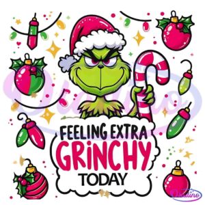 A green creature with a grumpy expression, wearing a red Santa hat, holds a candy cane. Surrounding it are colorful Christmas ornaments and lights. Text at the bottom reads, "FEELING EXTRA GRINCHY TODAY.