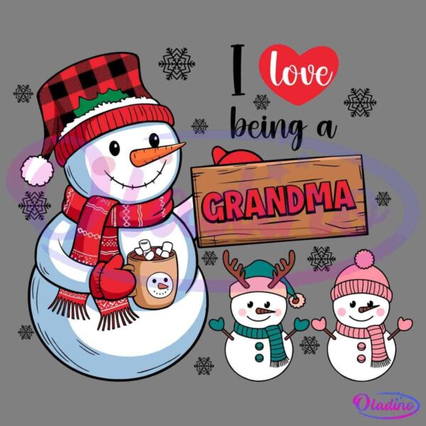 A cheerful snowman wearing a red and black plaid hat and red scarf holds a cup of hot chocolate. Beside it is a wooden sign with "GRANDMA" written on it. Two small snowmen in winter clothes stand next to the sign, with a heart above saying "love".