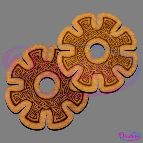 Two wooden, gear-shaped coasters with intricate Celtic knot designs. The coasters have a central circular cutout and interwoven patterns etched on their surfaces. The wood has a light, natural finish, and the designs are darkly stained for contrast.