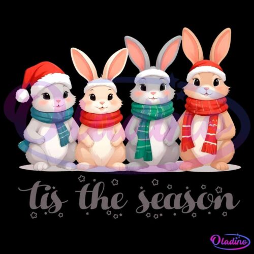 Four adorable cartoon bunnies dressed in winter attire stand in a row. Two bunnies wear Santa hats, and all four don scarves in red, blue, or green. Below them is the phrase "tis the season" written in a whimsical font with small star decorations.